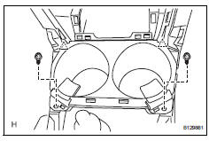 Toyota RAV4. Install console cup holder box