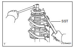 Toyota RAV4. Remove front support to front shock absorber nut