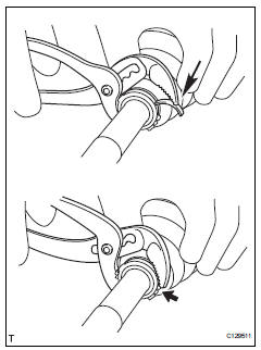 Toyota RAV4. Install front axle outboard joint boot clamp