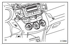 Toyota RAV4. Remove air conditioning control assembly