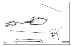 Toyota RAV4. Remove vanity light assembly