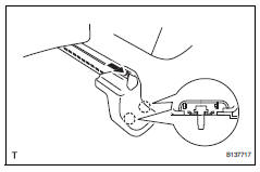 Toyota RAV4. Remove front seat track bracket inner cover lh