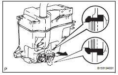 Toyota RAV4. Remove windshield washer motor and pump assembly