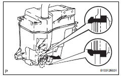 Toyota RAV4. Remove rear washer motor and pump assembly